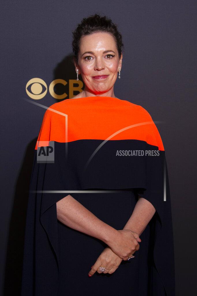 Joel C Ryan Olivia Colman poses for photographers as she arrives for the Netflix Celebration of the 73rd Primetime Emmy Awards in central London, Sunday, Sept. 19, 2021. (Photo by Joel C Ryan/Invision/AP)