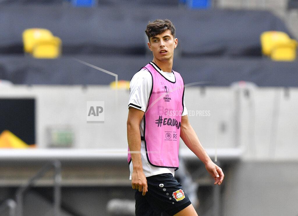 Martin Meissner FILE - In this Sunday Aug. 9, 2020 file photo, Leverkusen's Kai Havertz looks around during a training session in Duesseldorf, Germany. Bayer Leverkusen forward Kai Havertz left the Germany national team training camp on Friday, Sept. 4 to try to complete his transfer to Chelsea. Leverkusen sports director Rudi Voeller said Havertz is traveling to London “so that Kai can now sort things out on the ground in London with our support.” (AP Photo/Martin Meissner, file)