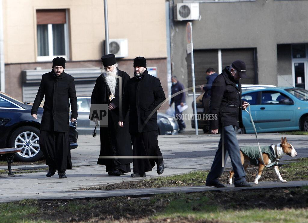 Darko Vojinovic Serbian Orthodox Church bishop Irinej Bulovic, second left, arrives in the St. Sava temple before church closed session in Belgrade, Serbia, Thursday, Feb. 18, 2021. The Serbian Orthodox Church gathers in closed session to pick a new Patriarch, following the death of old one Irinej. Irinej died last year of COVID, following the outbreak of virus among church officials in Belgrade (AP Photo/Darko Vojinovic)