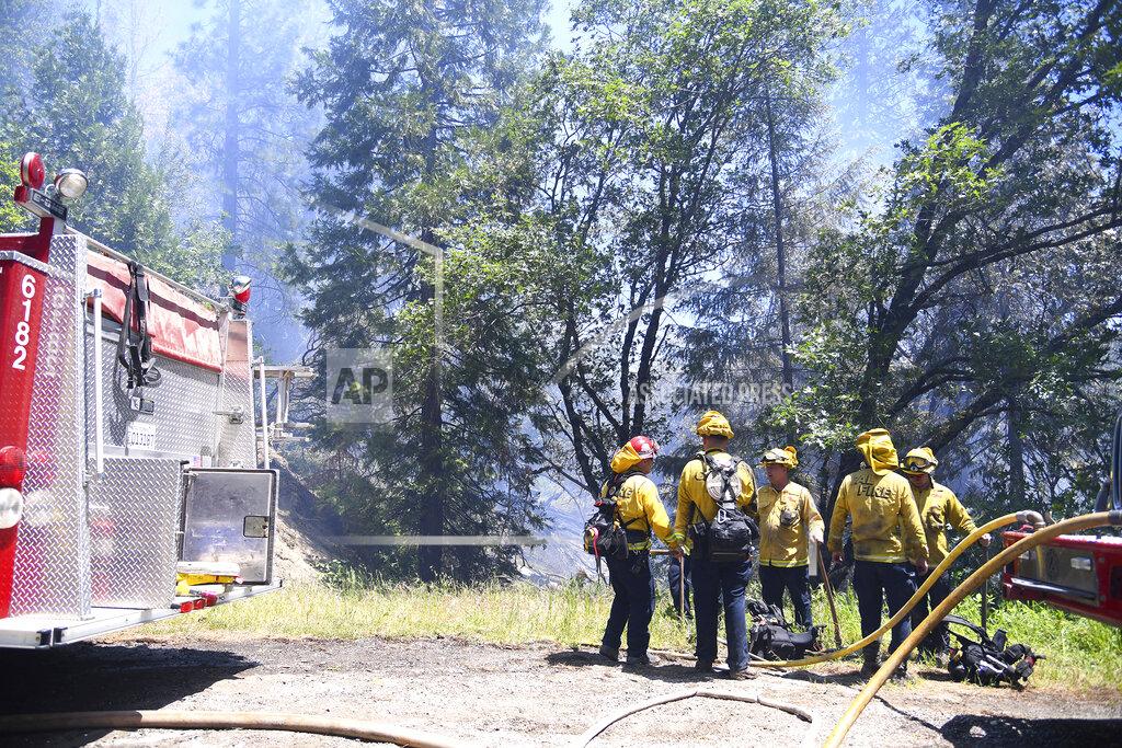 Elias Funez A Cal Fire engine crew readies to help secure a flank of the Golden Fire off of Highway 49 south of Camptonville, Calif. Friday, May 20, 202. (Elias Funez/The Union via AP)