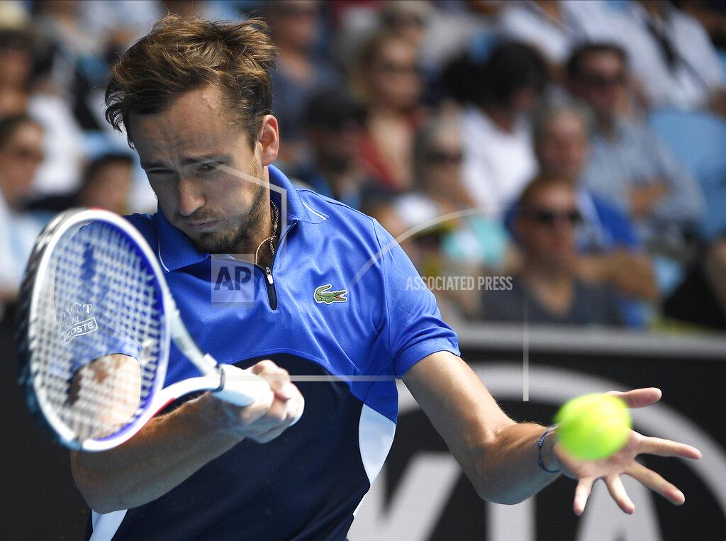 Andy Brownbill FILE - In this Jan. 27, 2020, file photo, Russia's Daniil Medvedev makes a forehand return to Switzerland's Stan Wawrinka during their fourth round singles match at the Australian Open tennis championship in Melbourne, Australia. Medvedev is scheduled to play in the U.S. Open, scheduled for Aug. 31-Sept. 13, 2020.(AP Photo/Andy Brownbill, File)