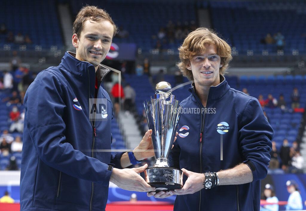 Hamish Blair Russia's ATP Cup winners Daniil Medvedev, and Andrey Rublev, right, pose with their trophy after defeating Italy in the final in Melbourne, Australia, Sunday, Feb. 7, 2021.(AP Photo/Hamish Blair)