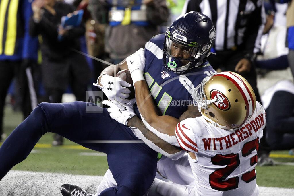 Ted S. Warren Seattle Seahawks' DK Metcalf, left, is wrapped up by San Francisco 49ers' Ahkello Witherspoon as he comes down with a touchdown reception in the end zone during the second half of an NFL football game, Sunday, Dec. 29, 2019, in Seattle. (AP Photo/Ted S. Warren)