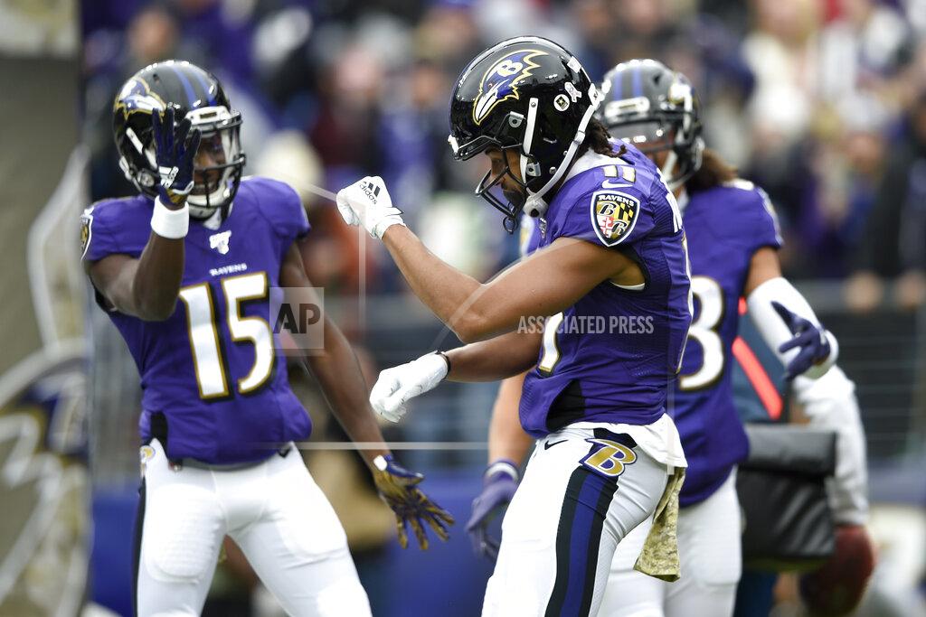 Gail Burton Baltimore Ravens wide receiver Seth Roberts (11) celebrates with teammates Marquise Brown (15) and Willie Snead (83) after scoring on a touchdown pass from Lamar Jackson, not visible, during the first half of an NFL football game against the Houston Texans, Sunday, Nov. 17, 2019, in Baltimore. (AP Photo/Gail Burton)