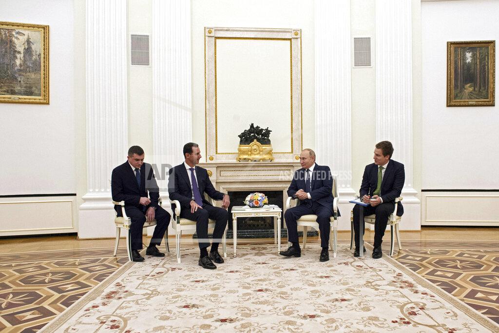 Mikhail Klimentyev Russian President Vladimir Putin, second right, speaks to Syrian President Bashar Assad during their meeting in the Kremlin in Moscow, Russia, Monday, Sept. 13, 2021. (Mikhail Klimentyev, Sputnik, Kremlin Pool Photo via AP)
