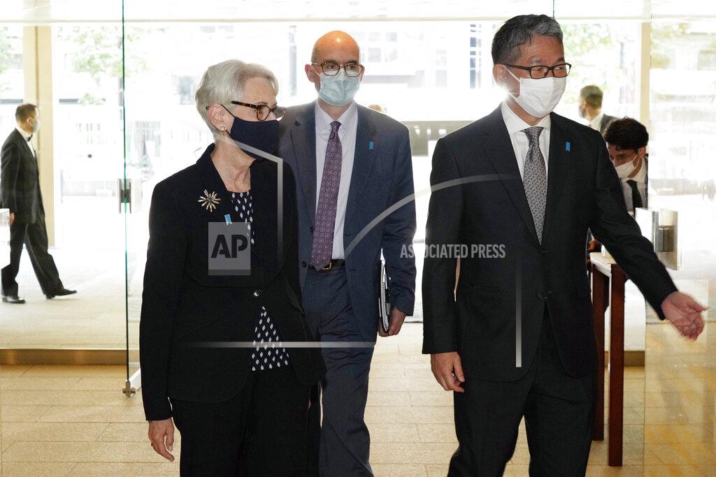 Eugene Hoshiko U.S. Deputy Secretary of State Wendy Sherman, left, is escorted by Japanese Vice-Minister for Foreign Affairs Takeo Mori, right, prior to their meeting at the Iikura Guesthouse Tuesday, July 20, 2021, in Tokyo. (AP Photo/Eugene Hoshiko, Pool)