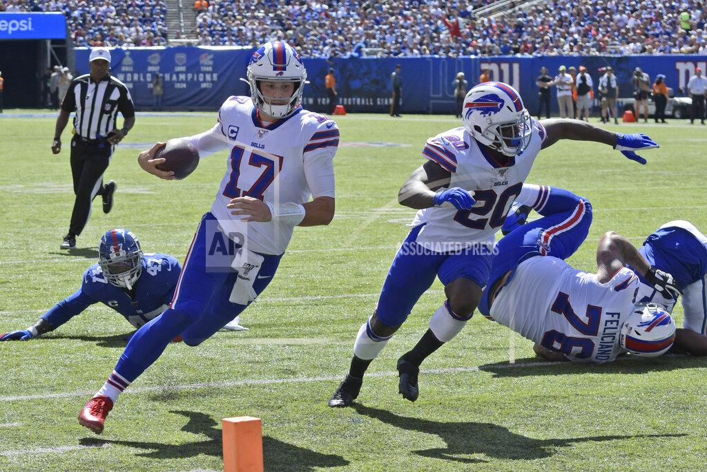 Bill Kostroun Buffalo Bills quarterback Josh Allen (17), left, runs the ball for a touchdown during the first half of an NFL football game against the New York Giants, Sunday, Sept. 15, 2019, in East Rutherford, N.J. (AP Photo/Bill Kostroun)