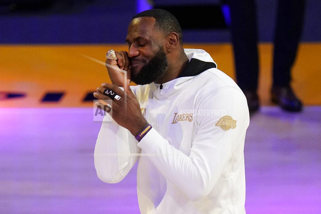 Marcio Jose Sanchez Los Angeles Lakers forward LeBron James reacts after receiving his NBA championship ring before an NBA basketball game against the Los Angeles Clippers, Tuesday, Dec. 22, 2020, in Los Angeles. (AP Photo/Marcio Jose Sanchez)