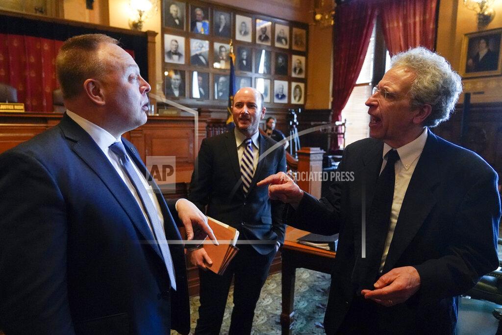 Ken Falk, right, talks with Tom Fisher following a Supreme Court hearing, Thursday, Jan. 19, 2023, in Indianapolis. A top state lawyer urged the Indiana Supreme Court to uphold the state's Republican-backed abortion ban, even as the justices weighed whether they should decide its constitutionality before lower courts have fully considered the case. (AP Photo/Darron Cummings, Pool)