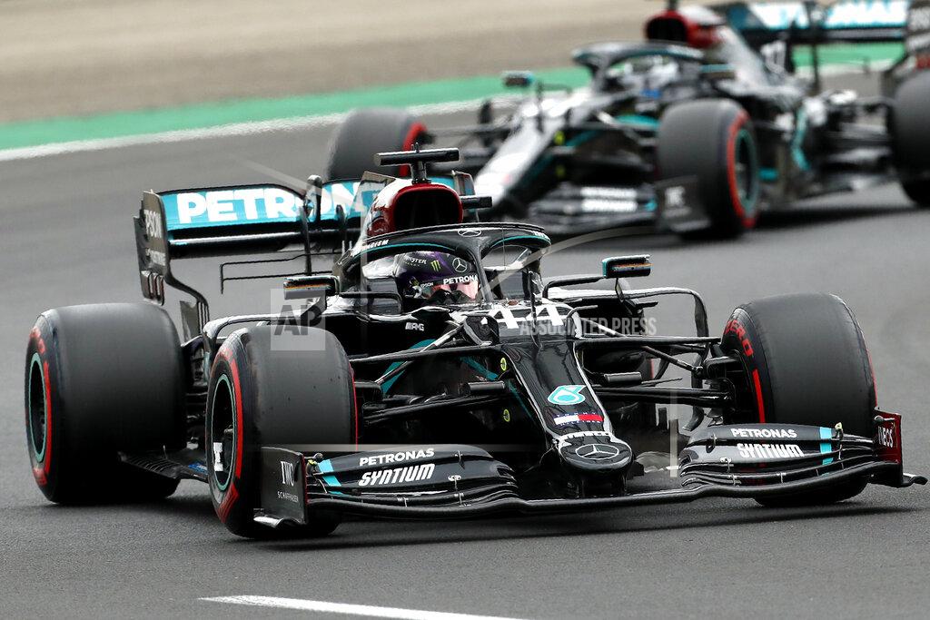 Darko Bandic Mercedes driver Lewis Hamilton of Britain leads his teammate Mercedes driver Valtteri Bottas of Finland during the qualifying session for the Hungarian Formula One Grand Prix at the Hungaroring racetrack in Mogyorod, Hungary, Saturday, July 18, 2020. The Hungarian F1 Grand Prix will be held on Sunday. (Darko Bandic/Pool)
