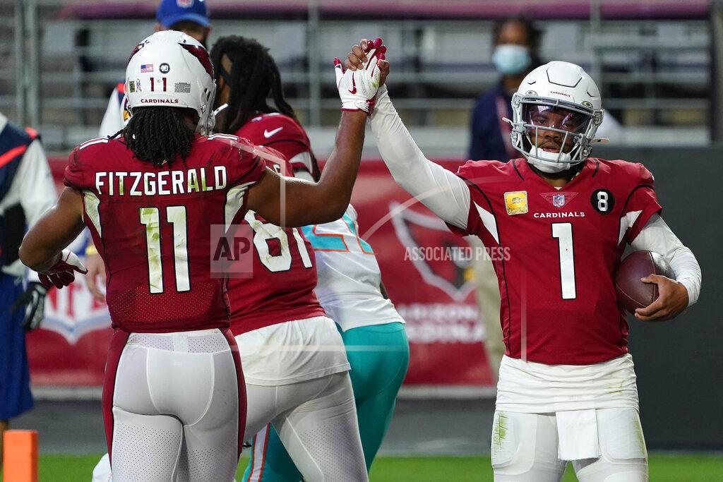 Rick Scuteri Arizona Cardinals quarterback Kyler Murray (1) high fives wide receiver Larry Fitzgerald (11) after scoring a touchdown against the Miami Dolphins during the second half of an NFL football game, Sunday, Nov. 8, 2020, in Glendale, Ariz. (AP Photo/Rick Scuteri)