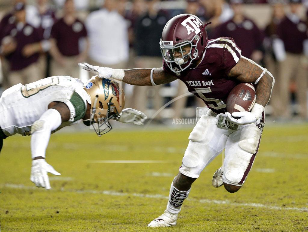 Michael Wyke UAB safety Mar'Sean Diggs, left, dives to tackle Texas A&M running back Trayveon Williams (5) during the second half of an NCAA college football game Saturday, Nov. 17, 2018, in College Station, Texas. (AP Photo/Michael Wyke)