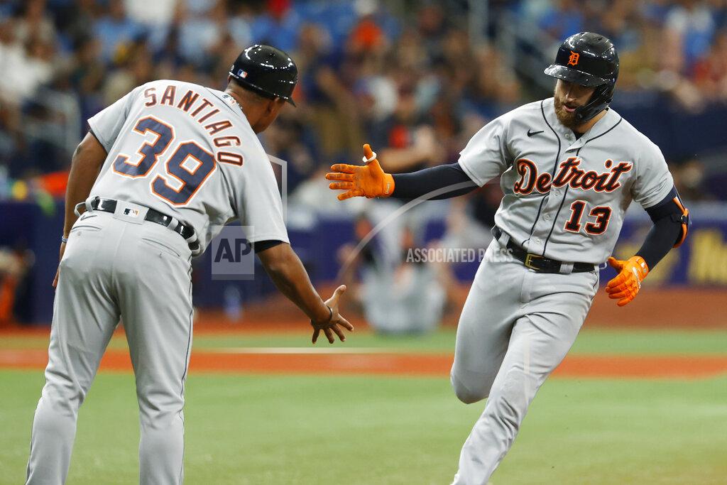 Scott Audette Detroit Tigers' Eric Haase (13) celebrates with third base coach Ramon Santiago after hitting a home run against the Tampa Bay Rays during the fourth inning of a baseball game Sunday, Sept. 19, 2021 in St. Petersburg, Fla. (AP Photo/Scott Audette)