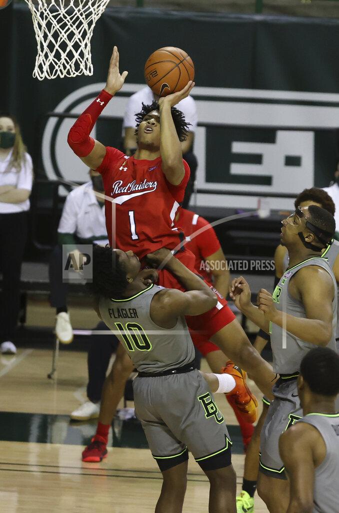 Jerry Larson Texas Tech guard Terrence Shannon Jr. (1) attempts a shot past Baylor guard Adam Flagler (10) in the first half of an NCAA college basketball game Sunday, March 7, 2021, in Waco, Texas. (AP Photo/Jerry Larson)