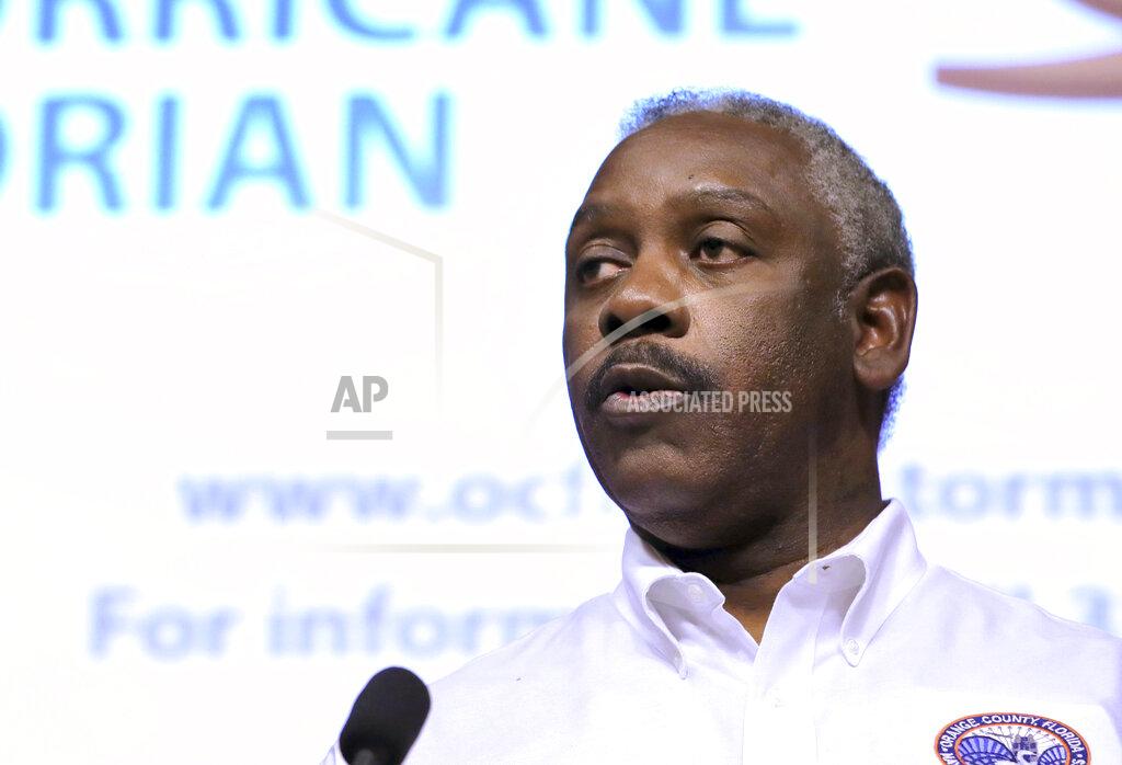 Joe Burbank FILE - In this Aug. 30, 2019, file photo, Orange County Mayor Jerry Demings briefs county residents on the status of Hurricane Dorian during a news conference at the Orange County Administration building in Orlando, Fla. As coronavirus cases continue to soar, two Florida mayors, including Demings, are announcing mask and vaccine mandates and defying Gov. Ron DeSantis, who is firmly opposed to any pandemic restrictions. (Joe Burbank/Orlando Sentinel via AP, File)