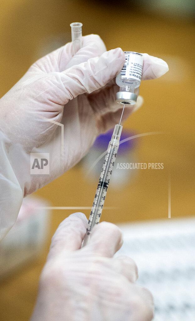 Michael Holahan A dose of the Pfizer COVID-19 vaccine is loaded into a syringe at University Hospital in Augusta, Ga., Tuesday, Dec. 22, 2020. (Michael Holahan/The Augusta Chronicle via AP)