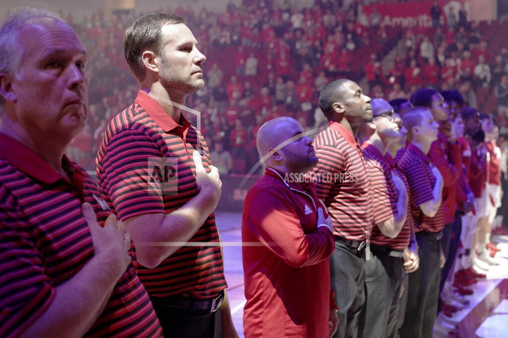 Nati Harnik In this Wednesday, Oct. 30, 2019 photo, Nebraska head coach Fred Hoiberg, second left, stands with staff and players before an NCAA college basketball exhibition game against Doane University in Lincoln, Neb. Hoiberg knows the track record of Nebraska basketball coaches is not good. He wanted the job anyway. He takes over a program that has not won a conference championship in 70 years or ever won a game in the NCAA Tournament. He says a sold-out arena and top-notch facilities can trump the program's lack of tradition. (AP Photo/Nati Harnik)