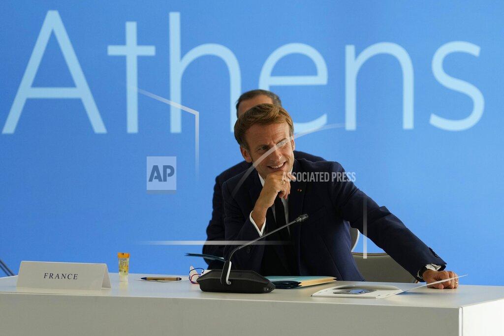 Thanassis Stavrakis French President Emmanuel Macron attends the EUMED 9 summit at the Stavros Niarchos Foundation Cultural Center in Athens, Friday, Sept. 17, 2021. Nine European countries on the Mediterranean are holding a summit in Athens to discuss issues ranging from climate change and the pandemic response to migration and Afghanistan. (AP Photo/Thanassis Stavrakis)
