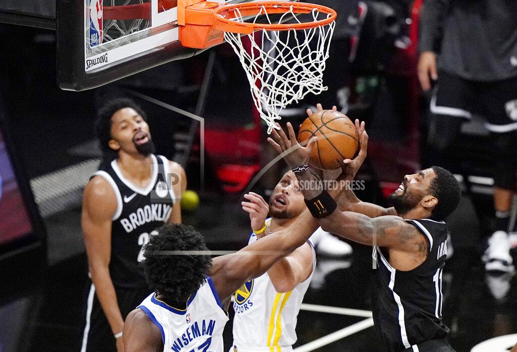 Kathy Willens Golden State Warriors center James Wiseman (33) and guard Stephen Curry try to interrupt a shot by Brooklyn Nets guard Kyrie Irving (11) during the second quarter of an NBA basketball game Tuesday, Dec. 22, 2020, in New York. (AP Photo/Kathy Willens)