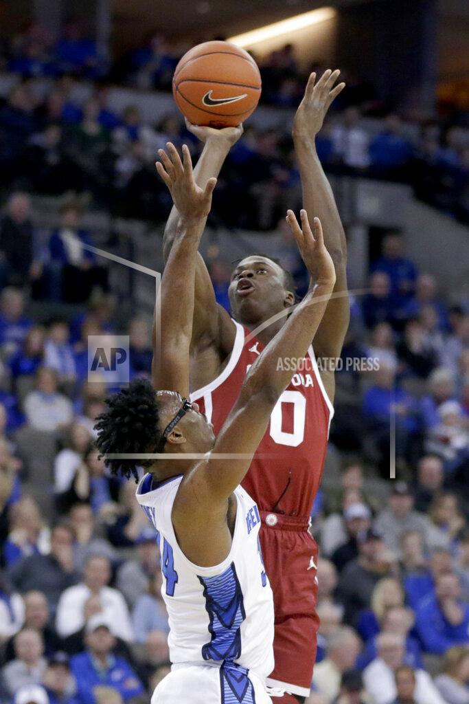 Nati Harnik Oklahoma's Victor Iwuakor (0) shoots over Creighton's Denzel Mahoney (34) during the first half of an NCAA college basketball game in Omaha, Neb., Tuesday, Dec. 17, 2019. (AP Photo/Nati Harnik)