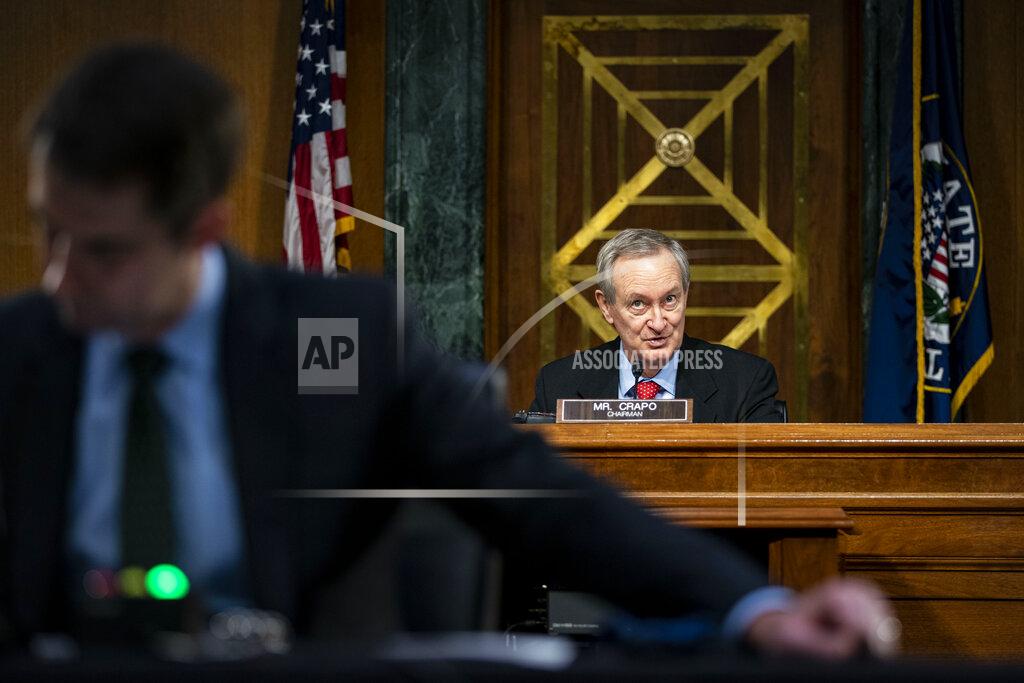 Al Drago Chairman Mike Crapo, R-Idaho, speaks as Federal Reserve Chair Jerome Powell and Treasury Secretary Steven Mnuchin, not pictured, testify during a Senate Banking Committee hearing on Capitol Hill, on Tuesday, Dec. 1, 2020, in Washington. (Al Drago/The New York Times via AP, Pool)