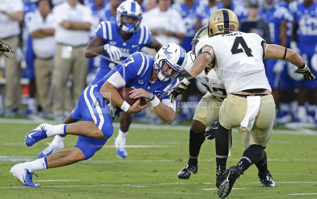 Gerry Broome Duke quarterback Daniel Jones (17) runs the ball while Army's Max Regan (4) looks for the tackle during the first half of an NCAA college football game in Durham, N.C., Friday, Aug. 31, 2018. (AP Photo/Gerry Broome)