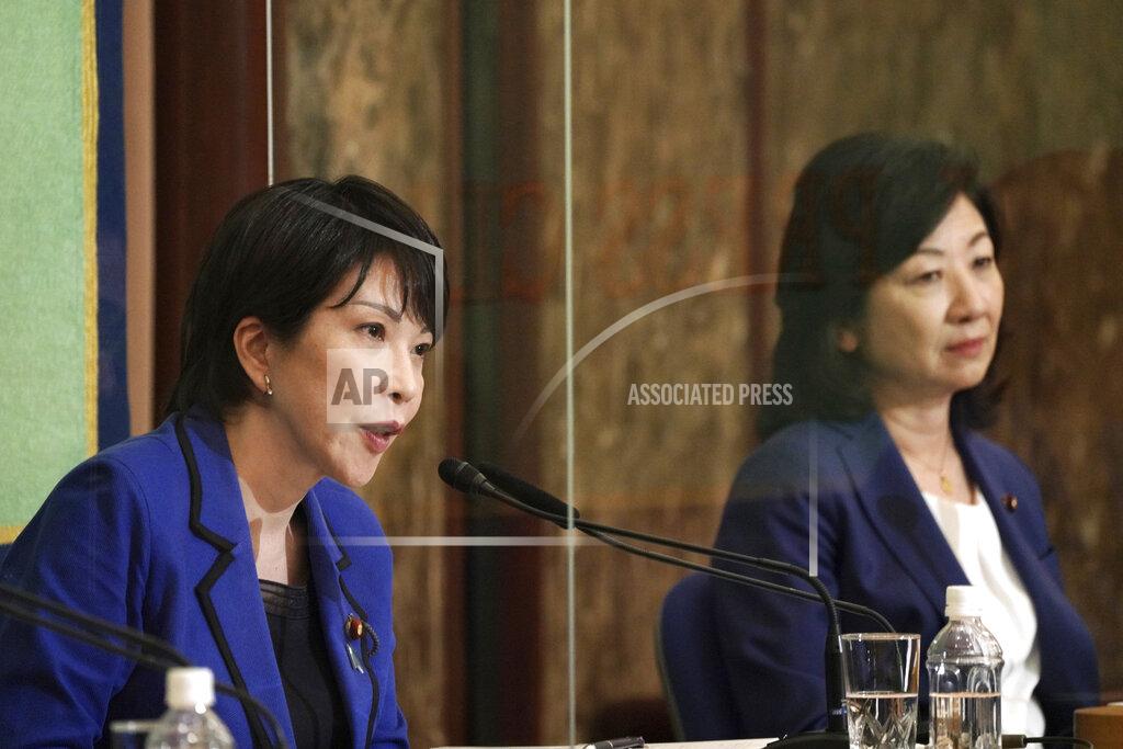 Eugene Hoshiko FILE - In this Sept. 18, 2021, file photo, Sanae Takaichi, left, and Seiko Noda, both former internal affairs ministers and candidates for the presidential election of the ruling Liberal Democratic Party, attend a debate session held by Japan National Press club in Tokyo. The stakes are high as Japanese governing party members vote Wednesday, Sept. 29, 2021 for four candidates seeking to replace Yoshihide Suga as prime minister. The next leader must address a pandemic-battered economy, a newly empowered military operating in a dangerous neighborhood, crucial ties with an inward-focused ally, Washington, and tense security standoffs with an emboldened China and its ally North Korea. (AP Photo/Eugene Hoshiko, Pool, File)