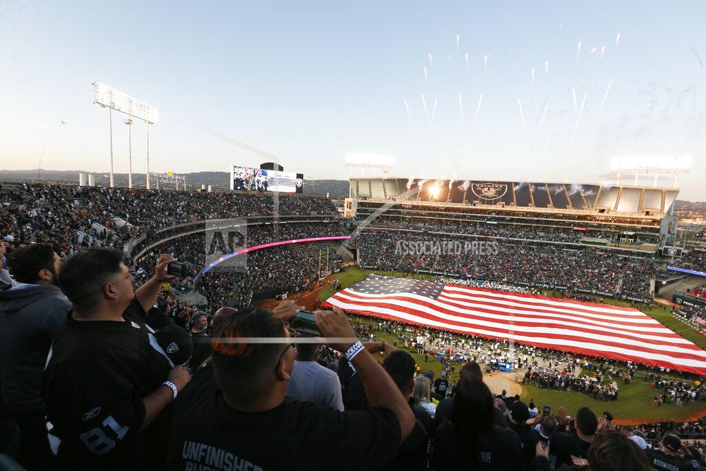 D. Ross Cameron Fans stand for the National Anthem at RingCentral Coliseum before the start of an NFL football game between the Oakland Raiders and the Denver Broncos Monday, Sept. 9, 2019, in Oakland, Calif. (AP Photo/D. Ross Cameron)