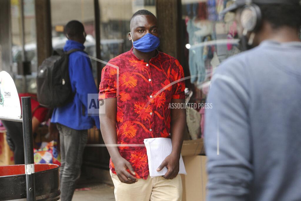 Tsvangirayi Mukwazhi Emmanuel Reyai walks on the streets of Harare while looking for a job, Wednesday, Aug, 5, 2020. Around the world, young people armed with new degrees, diplomas and professional qualifications are struggling to enter the workforce as the pandemic pushes the global economy into recession. Two years after graduating with from Zimbabwe’s Midlands State University, 24-year old Emmanuel Reyai is no closer to his goal of getting a job related to his degree in local governance. His search is stymied by both the African country’s economic collapse and the coronavirus outbreak. (AP Photo/Tsvangirayi Mukwazhi)