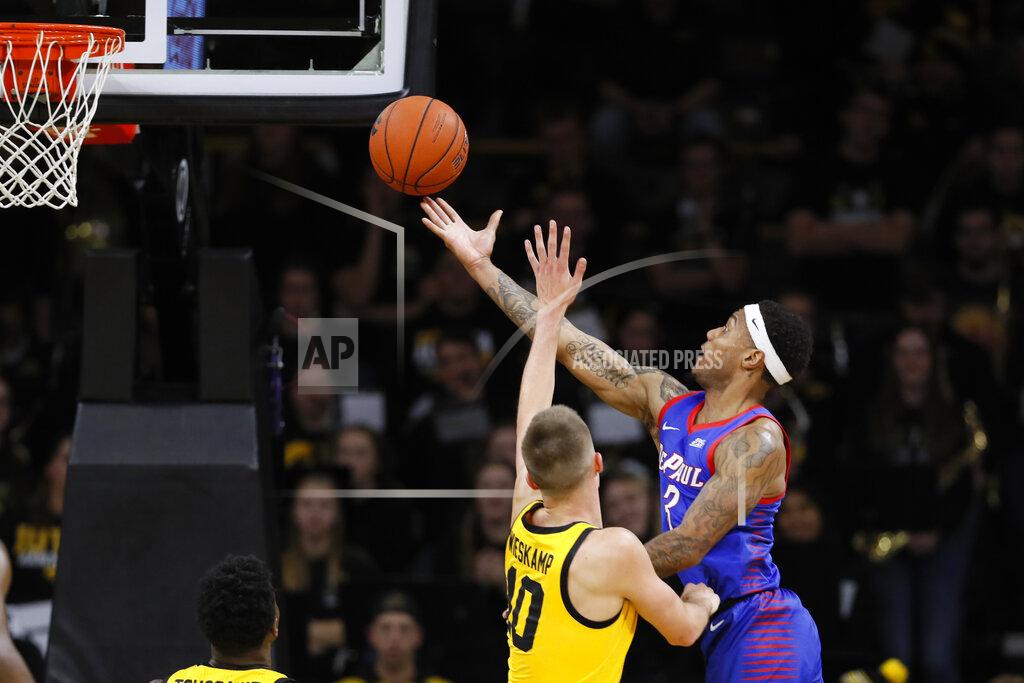 Charlie Neibergall DePaul guard Devin Gage, right, shoots over Iowa guard Joe Wieskamp during the second half of an NCAA college basketball game, Monday, Nov. 11, 2019, in Iowa City, Iowa. DePaul won 93-78. (AP Photo/Charlie Neibergall)