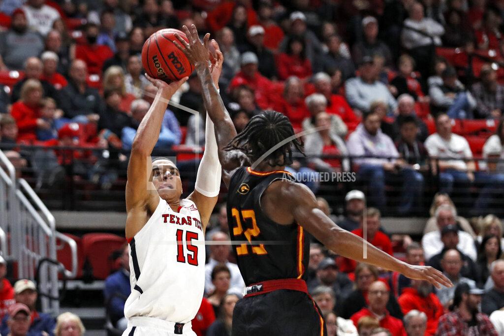 Brad Tollefson Texas Tech's Kevin McCullar (15) shoots the ball over Grambling State's Prince Moss (22) during the first half of an NCAA college basketball game against Grambling State, Friday, Nov. 12, 2021, in Lubbock, Texas. (Brad Tollefson/Lubbock Avalanche-Journal via AP)