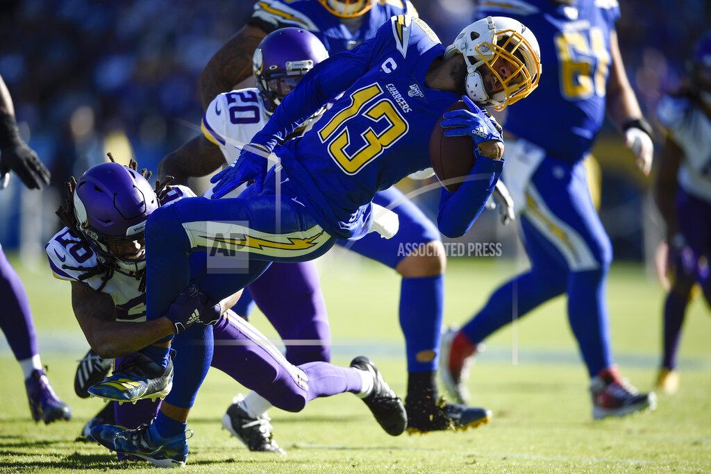 Kelvin Kuo Los Angeles Chargers wide receiver Keenan Allen is brought down by Minnesota Vikings cornerback Trae Waynes, left, during the first half of an NFL football game Sunday, Dec. 15, 2019, in Carson, Calif. (AP Photo/Kelvin Kuo)