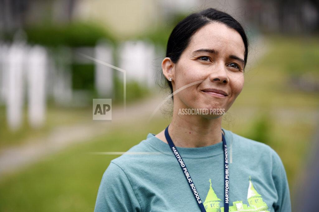 File-In this June 5, 2020, file photo, Hartford Public Schools Superintendent Dr. Leslie Torres-Rodriguez poses for a photo in Hartford, Conn. In Hartford, which has 14.7 students per teacher, the district serves many high-poverty communities and also brings in thousands of students from 60 other towns through school-choice programs. The superintendent there said the challenges associated with reopening are so severe, it may be time to come up with entirely new models for instruction. “Is it that the entire ecosystem has to be examined?” Torres-Rodriguez said (AP Photo/Jessica Hill, File)