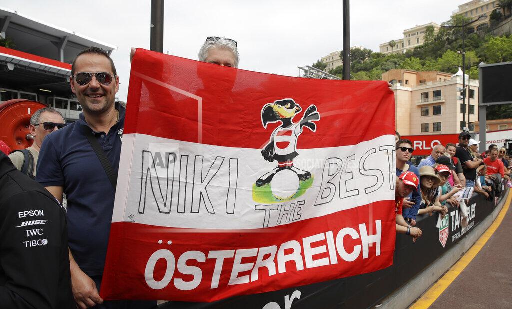 Luca Bruno Formula One supporters holds a banner to pay tribute to the three-time Formula One world champion Niki Lauda, at the Monaco racetrack, in Monaco, Friday, May 24, 2019. The Formula one race will be held on Sunday. (AP Photo/Luca Bruno)