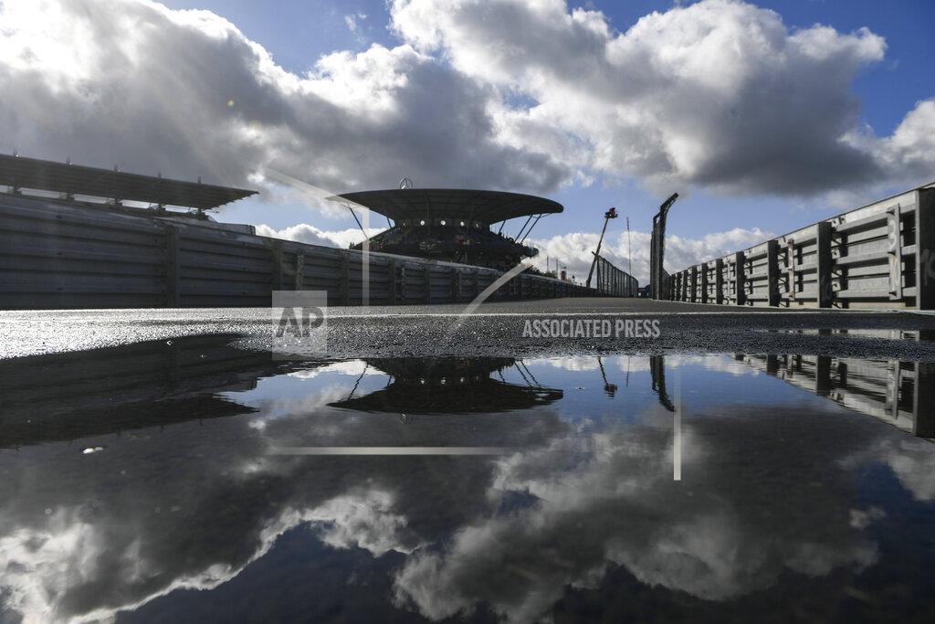 Ina Fassbender Clouds are reflected in a puddle prior to the start of the third practice session for the Eifel Formula One Grand Prix at the Nuerburgring racetrack in Nuerburg, Germany, Saturday, Oct. 10, 2020. The Germany F1 Grand Prix will be held on Sunday. (Ina Fassbender, Pool via AP)