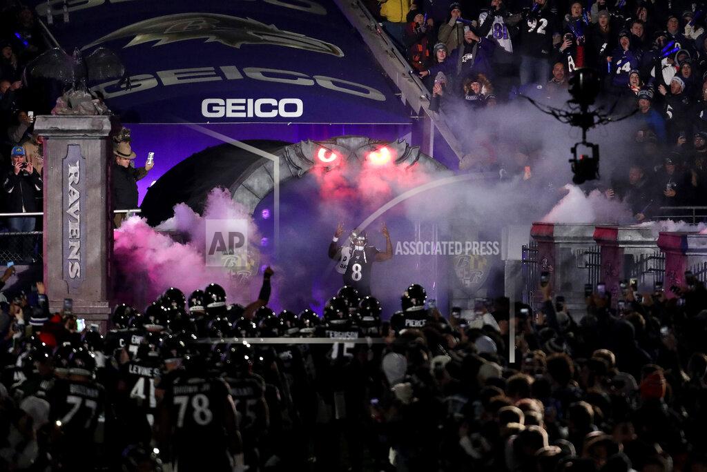 Julio Cortez Baltimore Ravens quarterback Lamar Jackson (8) is introduced onto the field prior to an NFL football game against the New York Jets, Thursday, Dec. 12, 2019, in Baltimore. (AP Photo/Julio Cortez)