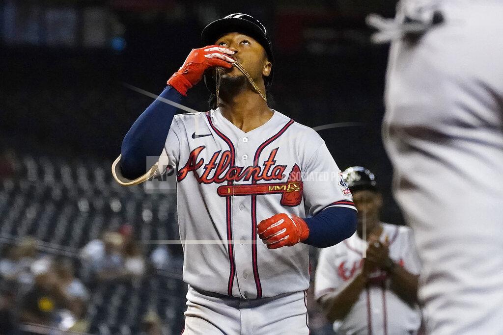 Matt York Atlanta Braves' Ozzie Albies celebrates his solo home run against the Arizona Diamondbacks during the third inning of a baseball game, Tuesday, Sept. 21, 2021, in Phoenix. (AP Photo/Matt York)