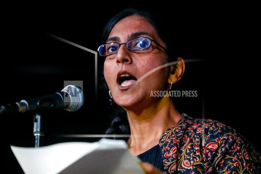 Seattle Councilmember Kshama Sawant speaks to supporters Tuesday, Dec. 7, 2021, in Seattle. Preliminary results show voters in Seattle narrowly in favor of recalling Sawant. (Jennifer Buchanan/The Seattle Times via AP)