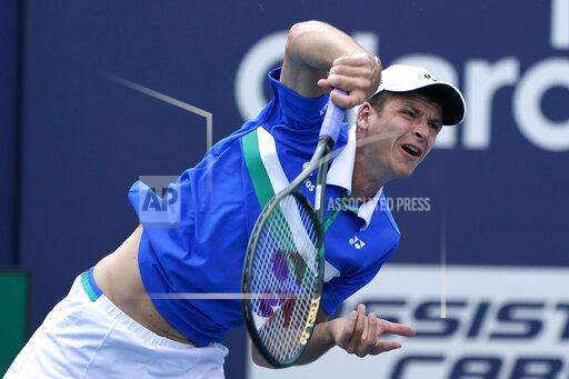 Lynne Sladky Hubert Hurkacz of Poland follows through on a serve to Stefanos Tsitsipas of Greece during the quarterfinals of the Miami Open tennis tournament, Thursday, April 1, 2021, in Miami Gardens, Fla. Hurkacz won 2-6, 6-3, 6-4. (AP Photo/Lynne Sladky)