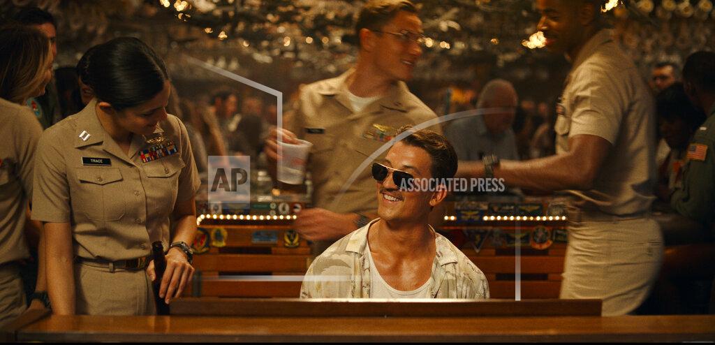 Uncredited This image released by Paramount Pictures shows Monica Barbaro, left, and Miles Teller in "Top Gun: Maverick." (Paramount Pictures via AP)