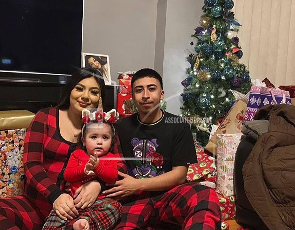 Uncredited This undated family photo provided by Todd Pugh and Tania Dimitrova, Attorneys for the Alvarez family, shows Giselle Higuera, left, Anthony Alvarez, right, with their daughter in Chicago. Alvarez was shot and killed after a foot chase with Chicago Police on March 31, 2021. (Courtesy Giselle Higuera and the Alvarez family via AP)