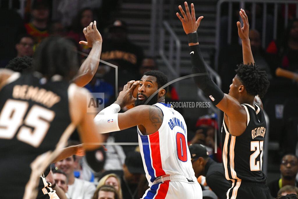 John Amis Detroit Pistons center Andre Drummond (0) looks to pass as Atlanta Hawks forward Cam Reddish, right, defends during the first half of an NBA basketball game Saturday, Jan. 18, 2020, in Atlanta. (AP Photo/John Amis)