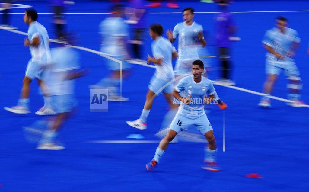 John Locher Argentina players warm up before a men's field hockey match against Japan at the 2020 Summer Olympics, Sunday, July 25, 2021, in Tokyo, Japan. (AP Photo/John Locher)