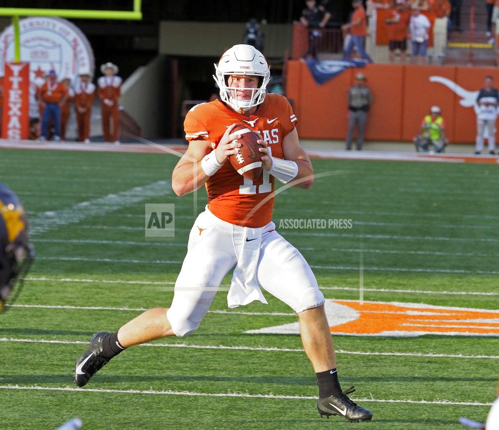 Michael Thomas Texas quarterback Sam Ehlinger looks to throw during the second half of an NCAA college football game West Virginia, Saturday, Nov. 3, 2018, in Austin, Texas. West Virginia won 42-41. (AP Photo/Michael Thomas)
