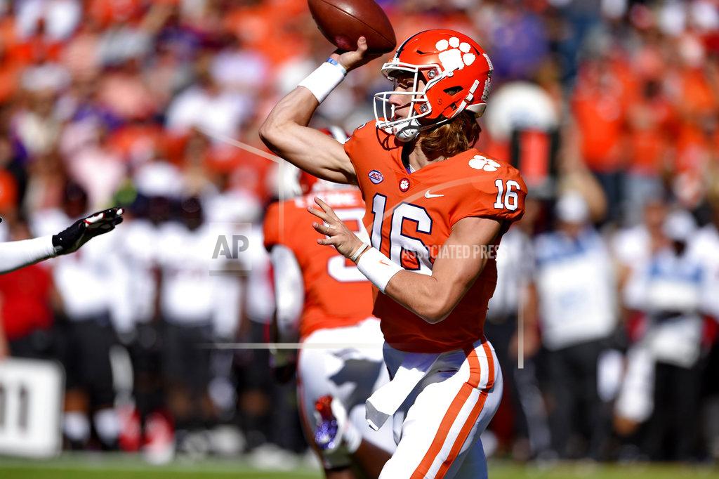 Richard Shiro Clemson quarterback Trevor Lawrence throws a pass during the first half of an NCAA college football game against Louisville Saturday, Nov. 3, 2018, in Clemson, S.C. (AP Photo/Richard Shiro)