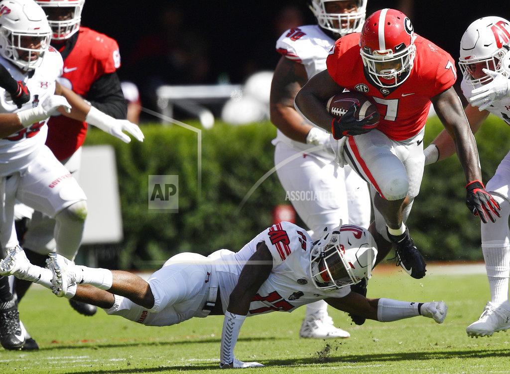 Mike Stewart Georgia running back D'Andre Swift (7) runs by Austin Peay defensive back Rashon Davis (17)during the first half of an NCAA college football game, Saturday, Sept. 1, 2018, in Athens, Ga. (AP Photo/Mike Stewart)