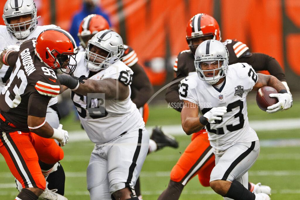 Ron Schwane Las Vegas Raiders running back Devontae Booker (23) rushes during the first half of an NFL football game against the Cleveland Browns, Sunday, Nov. 1, 2020, in Cleveland. (AP Photo/Ron Schwane)