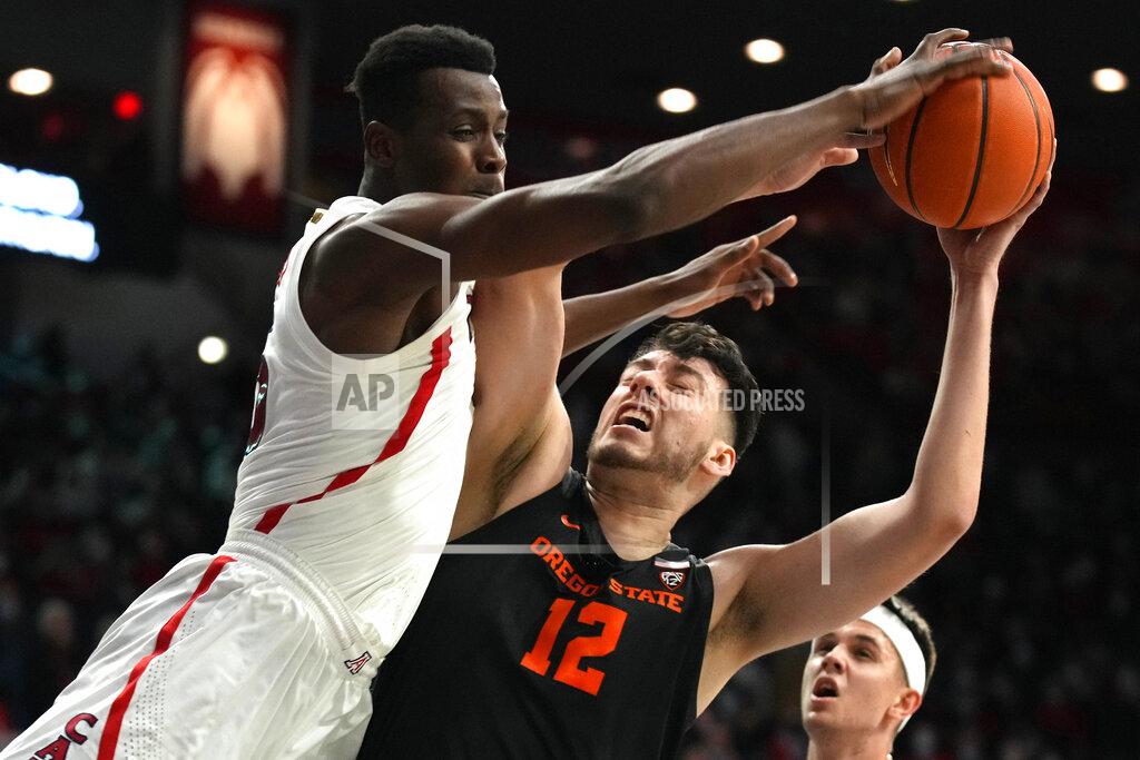 Rick Scuteri Arizona center Christian Koloko blocks the shot of Oregon State center Roman Silva (12) during the first half of an NCAA college basketball game Thursday, Feb. 17, 2022, in Tucson, Ariz. (AP Photo/Rick Scuteri)