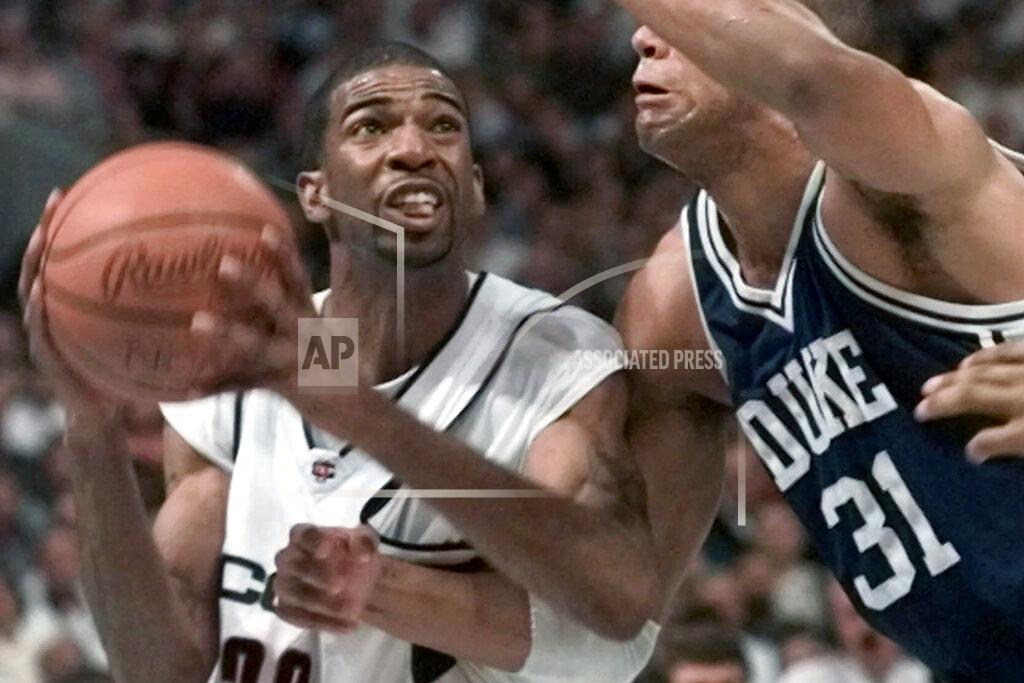 Eric Draper FILE - In this March 29, 1999, file photo, Connecticut's Richard Hamilton looks for a shot as he is defended by Duke's Shane Battier (31) in the second half of the NCAA college basketball Final Four championship game in St. Petersburg, Fla. UConn defeated Duke 77-74. (AP Photo/Eric Draper, File)