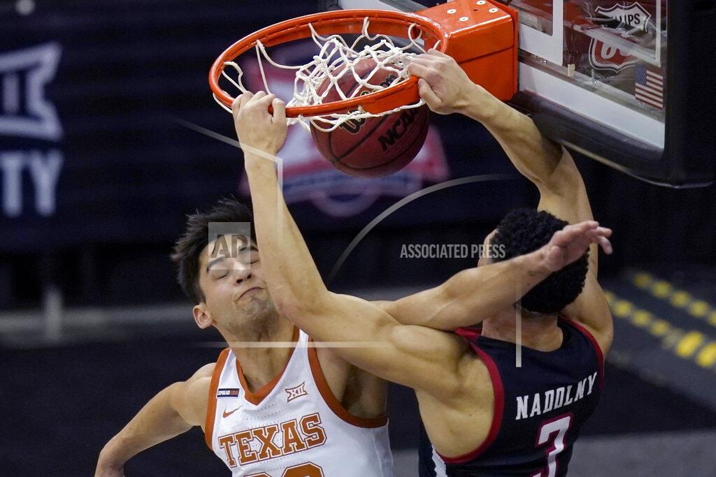 Orlin Wagner Texas Tech guard Clarence Nadolny (3) is fouled by Texas forward Brock Cunningham, left, during the first half of an NCAA college basketball game in the quarterfinal round of the Big 12 men's tournament in Kansas City, Mo., Thursday, March 11, 2021. (AP Photo/Orlin Wagner)